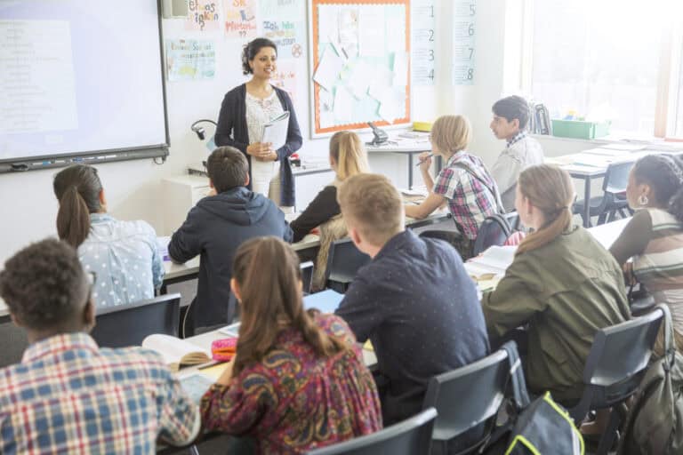 Teacher with a class of secondary students